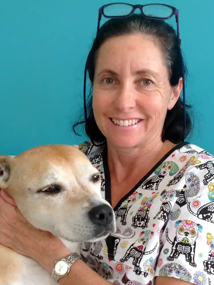 Dr. Christine with a dog