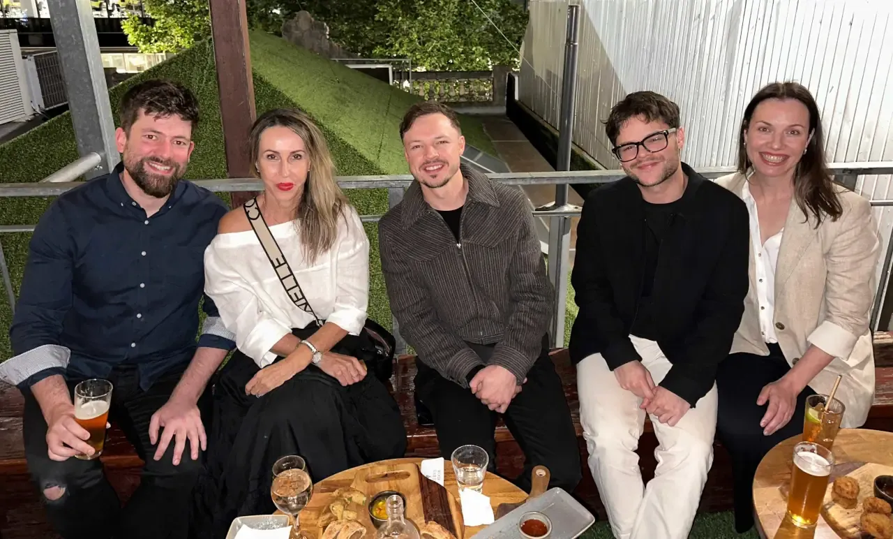 Vets enjoying drinks and snacks