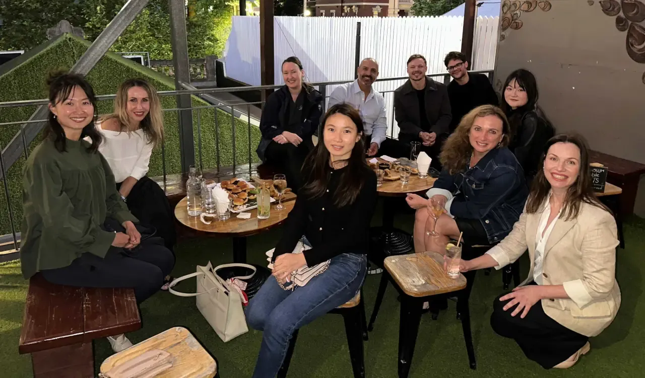 Vets and Pawssum employees having drinks and snacks