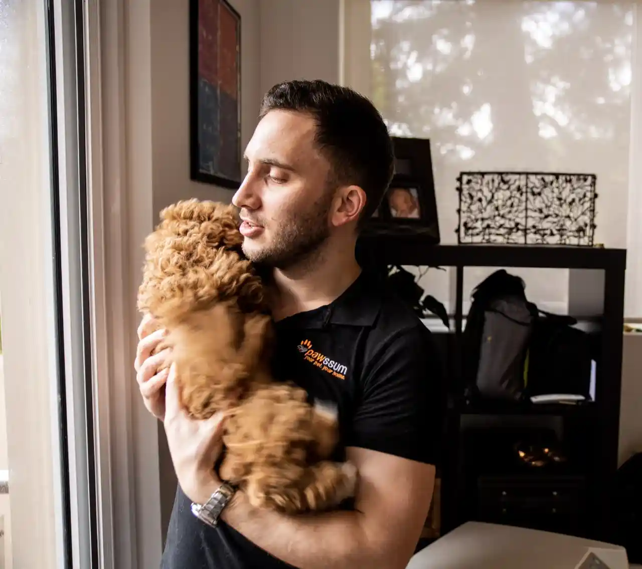 Vet cradling small fluffy dog